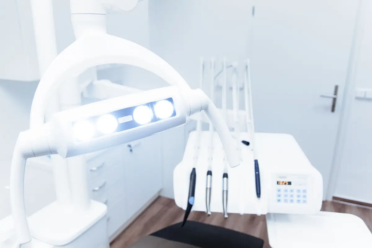 Clean modern clinical treatment room with equipment